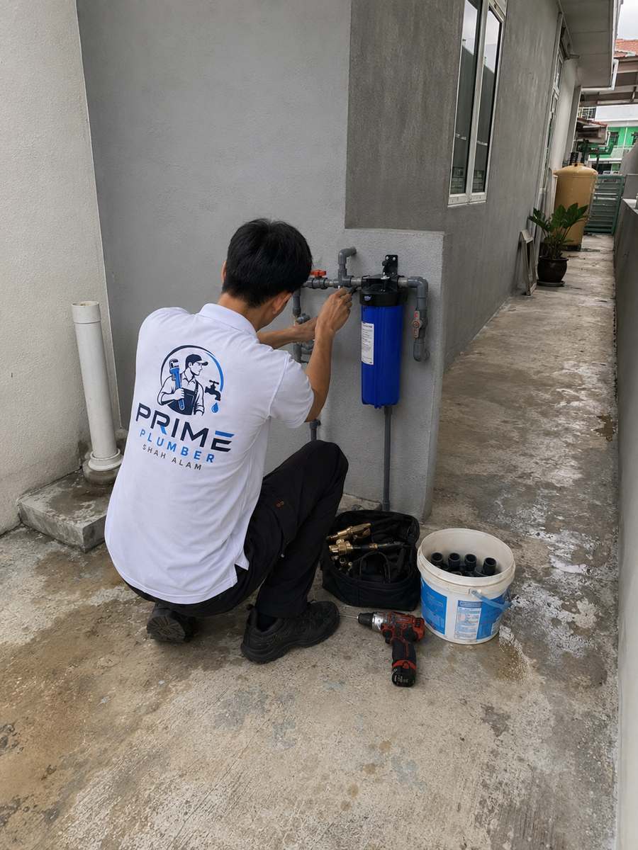Plumber installing a water filter in Shah Alam